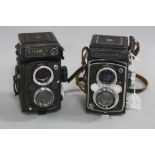 A YASHICA MAT TLR CAMERA, and a Yashica Mat 124g TLR camera, a cased Yashinon Auxilliary wide angled