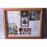 A LARGE GLAZED FRAME CONTAINING MEDALS, photos and ephemera relating to a Sgt Harold Jackson. VC (