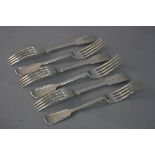 A MATCHED SET OF SIX VICTORIAN SILVER FIDDLE PATTERN TABLE FORKS, engraved crest to backs, makers