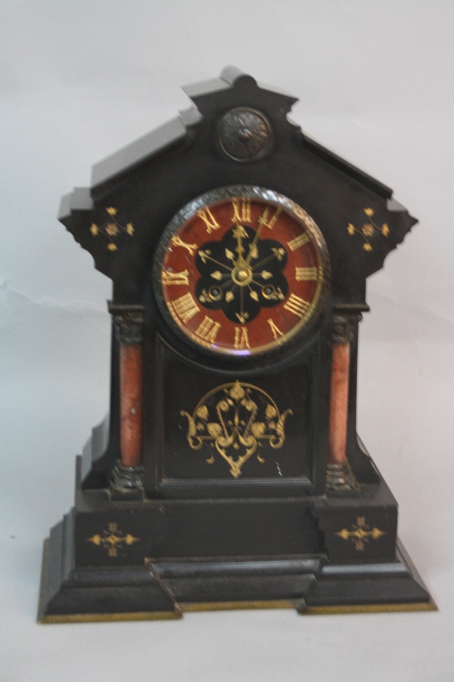 A LATE 19TH CENTURY BLACK SLATE MANTEL CLOCK, of architectural form, the marble and slate dial