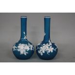 A PAIR OF CONTEMPORARY CAMEO GLASS VASES, having globular body and long neck, turquoise glass ground