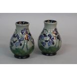 A PAIR OF MOORCROFT SHRINKING VIOLET PATTERN BALUSTER VASES, circa 2013, impressed and painted