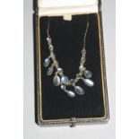 AN EARLY 20TH CENTURY MOONSTONE FRINGE NECKLET, graduating round and oval cabachon fine quality