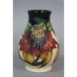 A MOORCROFT ANNA LILY PATTERN BALUSTER VASE, impressed painted marks and a printed blue cross and