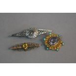 A BROOCH COLLECTION, to include a continental amethyst and turquoise brooch, amethyst measuring