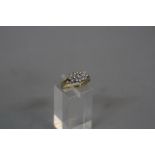 A LATE 20TH CENTURY 18CT GOLD DIAMOND OVAL CLUSTER RING, estimated total diamond weight