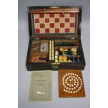 AN EXOTIC HARDWOOD GAMES COMPENDIUM, marked W.M. Gatty to lock escutcheon (no key), fitted