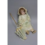 AN ARMAND MARSEILLE BISQUE HEAD DOLL, nape of neck marked 'A.M.D.E.P. 2/0' with a date obscured by