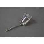 A GEORGE III SILVER CADDY SPOON, engraved decoration to the handle and scoop shaped bowl, makers