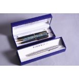 A BOXED WATERMANS FOUNTAIN PEN, brushed stainless steel, finish with chrome trim with care