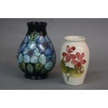 A MOORCROFT TUDOR ROSE (BLUE) BALUSTER VASE, circa 1993, height approximately 13cm, together with