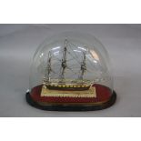 A MINIATURE SCRATCH BUILT MODEL OF AN EARLY 19TH CENTURY THREE MASTED SHIP, bone and painted,