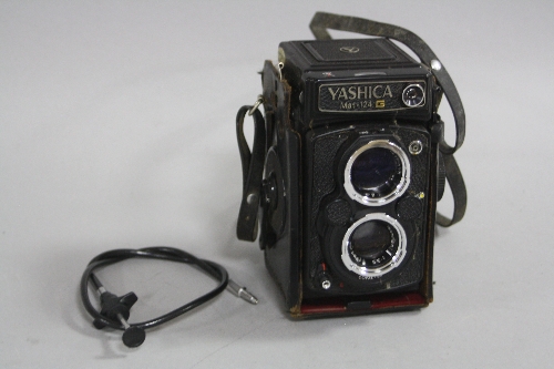 A YASHICA MAT124G TLR CAMERA, with black leather case, 80mm 1:2.8 and 80mm 1:3.5 lenses, lens cap