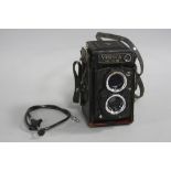 A YASHICA MAT124G TLR CAMERA, with black leather case, 80mm 1:2.8 and 80mm 1:3.5 lenses, lens cap