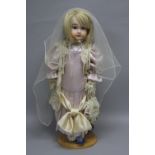 A CREATIONS PAST REPRODUCTION PORCELAIN DOLL, nape of neck marked 'A19 Paris CP 1985 UK' and stamped