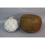 AN ATHERSTONE TOWN BALL GAME BROWN LEATHER BALL, the surface covered in signatures, bears hand