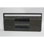 A BANG & OLUFSEN BEOSYSTEM 10 RADIO CASSETTE PLAYER, constructed of matt black aluminium with fabric