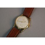 A 9CT RECORD GENTLEMANS WRISTWATCH, with subsidiary seconds dial