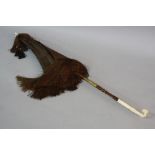 A LATE VICTORIAN BROWN SILK PARASOL, with ivory fittings to handle and finial, folding handle