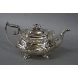 A 19TH CENTURY WHITE METAL TEAPOT, of shaped rectangular form, foliate cast finial and rim accanthus