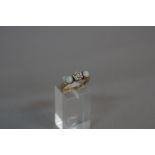 A VICTORIAN 18CT GOLD DIAMOND AND OPAL THREE STONE RING, one cushion old cut diamond, estimated