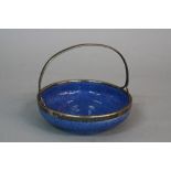 A MOORCROFT POTTERY POWDER BLUE CIRCULAR SWEETMEAT BASKET, fitted with plated handle and rim,