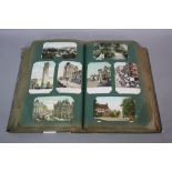 A VERY LARGE COLLECTION OF POSTCARDS, dating from the late 19th/early 20th Century, in an album,