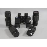 FOUR CAMERA ZOOM LENSES AND A PAIR OF TASCO 10 X 50 BINOCULARS, a Tokina 28-70mm 1:4 (Pentax fit), a