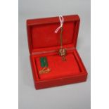 A ROLEX WATCH BOX, red with red and green plastic tags