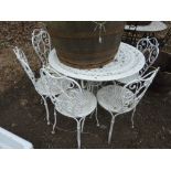 A WHITE PAINTED CIRCULAR METAL GARDEN TABLE, approximate diameter 97cm and six chairs (7)