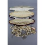 A QUANTITY OF COSTUME JEWELLERY, to include Lotus simulated pearl necklaces, an early 20th Century