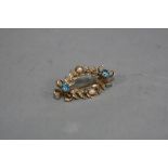 A MID 20TH CENTURY 9CT GOLD BLUE ZIRCON AND CULTURED PEARL BROOCH, in the form of oval wreath,