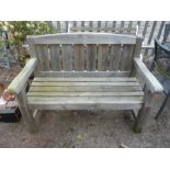 A SOFTWOOD SLATTED GARDEN BENCH, approximate length 124cm