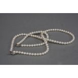 A MODERN CULTURED PEARL AND DIAMOND NECKLACE AND BRACELET SET, a cultured fresh water pearl necklace
