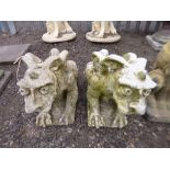 A PAIR OF PRE-CAST GARDEN FIGURES OF 'GRIFFINS'