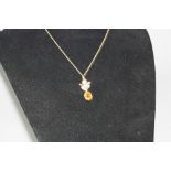 A MID 20TH CENTURY 9CT GOLD CITRINE PENDANT, one oval mixed cut citrine measuring approximately 12mm