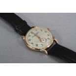 A GOLD I.W.C. GENTS WRISTWATCH, (condition ticks, scratches to back)