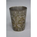 A PERSIAN BEAKER OF CONICAL FORM, engraved foliate decoration, height 11cm