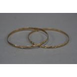 A MATCHING PAIR OF LATE 20TH CENTURY SLAVE BANGLES, 'D' shaped section, measuring approximately 67mm