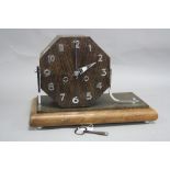 AN ART DECO STYLE OAK AND WALNUT CASED MANTEL CLOCK, with angular chrome supports, chromed Arabic