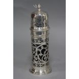 AN EDWARDIAN SILVER CASTOR OF CYLINDRICAL FORM, flame finial on a bayonet fitting pull off cover,