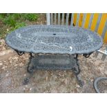 A MODERN BLACK PAINTED CAST ALUMINIUM GARDEN TABLE, with rounded ends, approximate size length 140cm