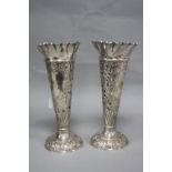 A PAIR OF SILVER TRUMPET VASES, having pierced and embossed scroll and floral decoration to