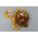 TWO STRINGS OF BAKELITE BEADS