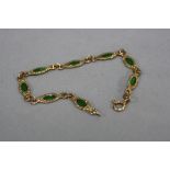 A 9CT BRACELET, set with eight green stones, approximate length 17cm