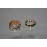 TWO RINGS, to include an early 20th Century 9ct gold signet ring, shield shaped head with engraved