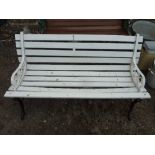 A WHITE PAINTED SLATTED GARDEN BENCH, with cast iron ends, approximate length 122cm