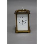 A MATTHEW NORMAN OF LONDON AND SWITZERLAND BRASS CASED CARRIAGE CLOCK, enamel dial, Roman