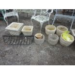 A BLACK PAINTED METAL WALL RACK, eight various pre-cast planters and a small clay pot (10)