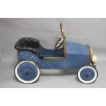 A CHILD'S VINTAGE STYLE TIN PLATE TOY CAR, metal frame with plastic seat, steering wheel and